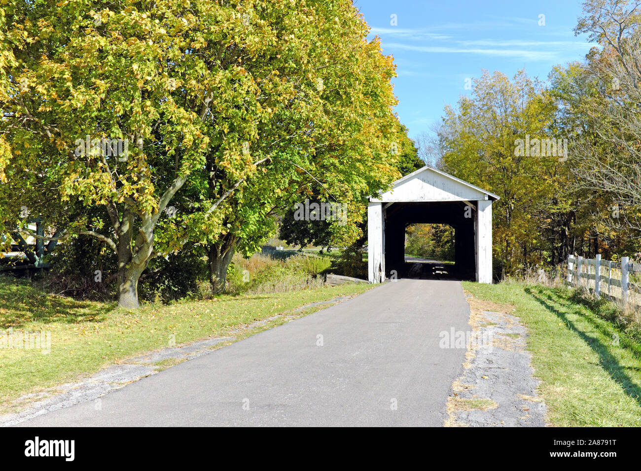 Wooden covered bridge on a rural road in Ashtabula County, Ohio, USA. Stock Photo