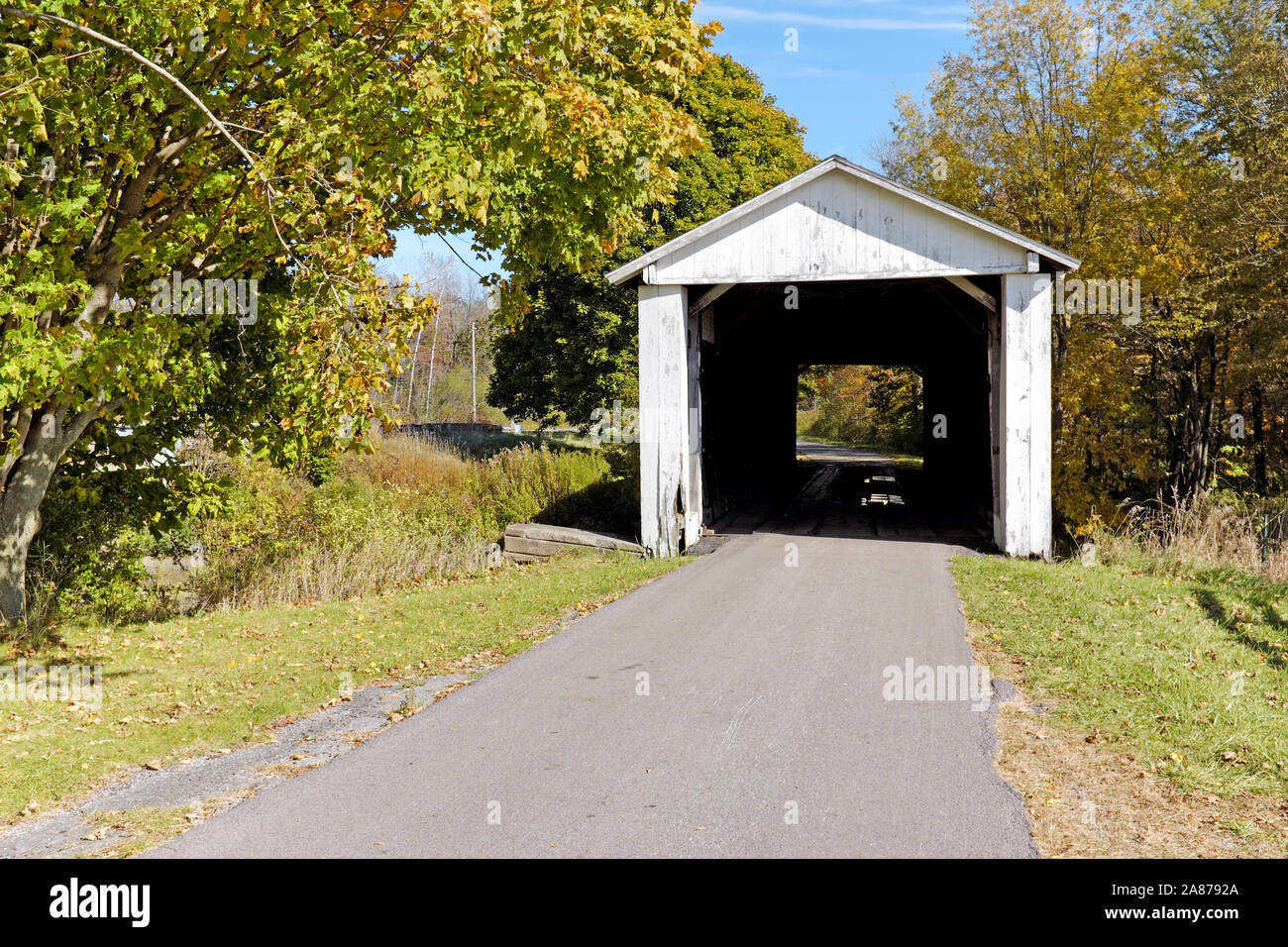 Wooden covered bridge on a rural road in Ashtabula County, Ohio, USA. Stock Photo