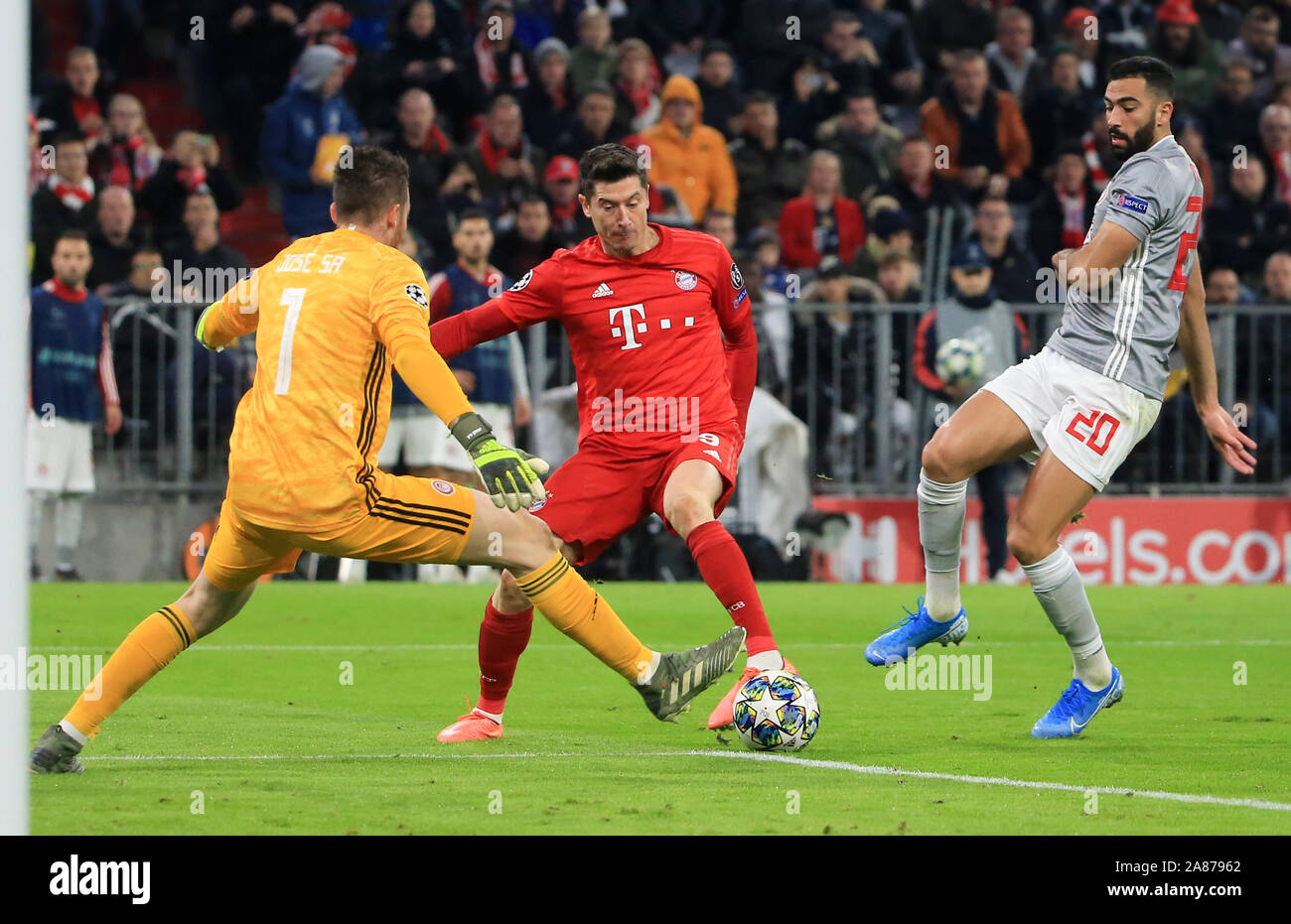 Munich, Germany. 6th Nov, 2019. Robert Lewandowski (C) of Bayern Munich vies with goalkeeper Jose Sa of Olympiacos during a UEFA Champions League group B match between FC Bayern Munich of Germany and Olympiacos Piraeus of Greece in Munich, Germany, on Nov. 6, 2019. Credit: Philippe Ruiz/Xinhua/Alamy Live News Stock Photo