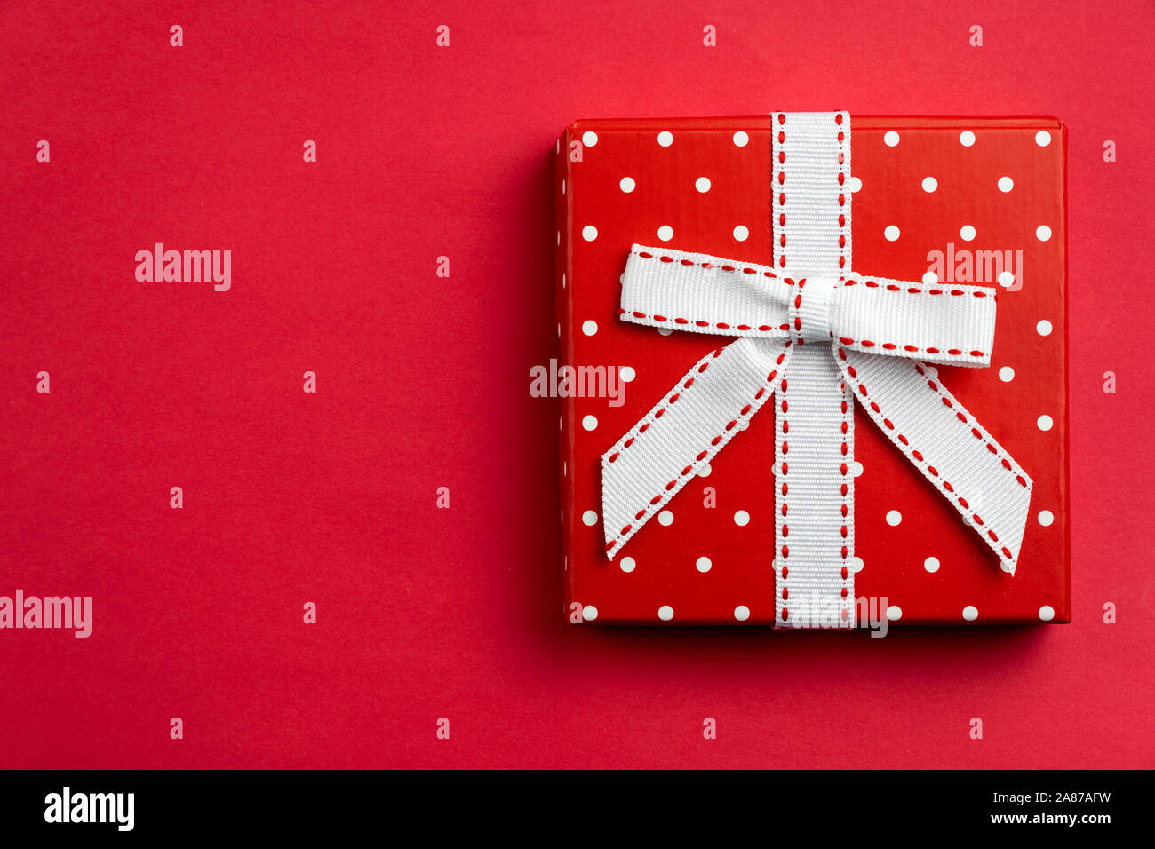 Flat lay red polka dots gift box Stock Photo
