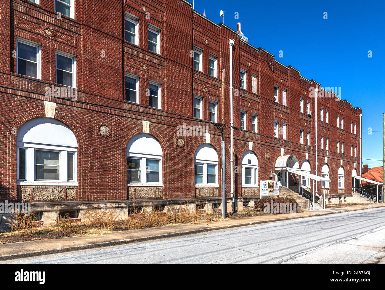 ERWIN, TN, USA-28 OCT 2019: Brick office building of CSX Transportation, a railroad operating in eastern U.S.  The large building originally served fo Stock Photo