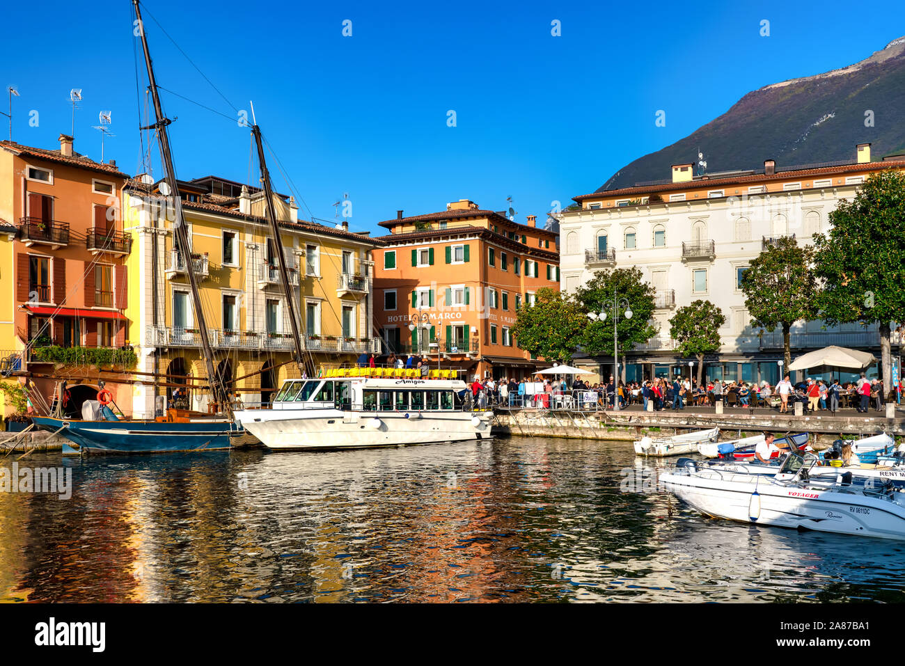 Malcesine, Italy, 10/27/2019: View of Malcesine at the lakeside of Lake Garda in summer in the northern Italy. Malcesine is a popular holiday location Stock Photo