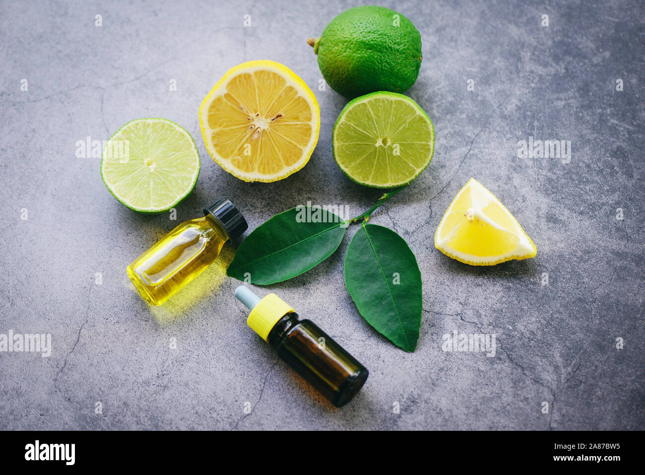 Aromatherapy herbal oil bottles aroma with lime lemon leaves herbal