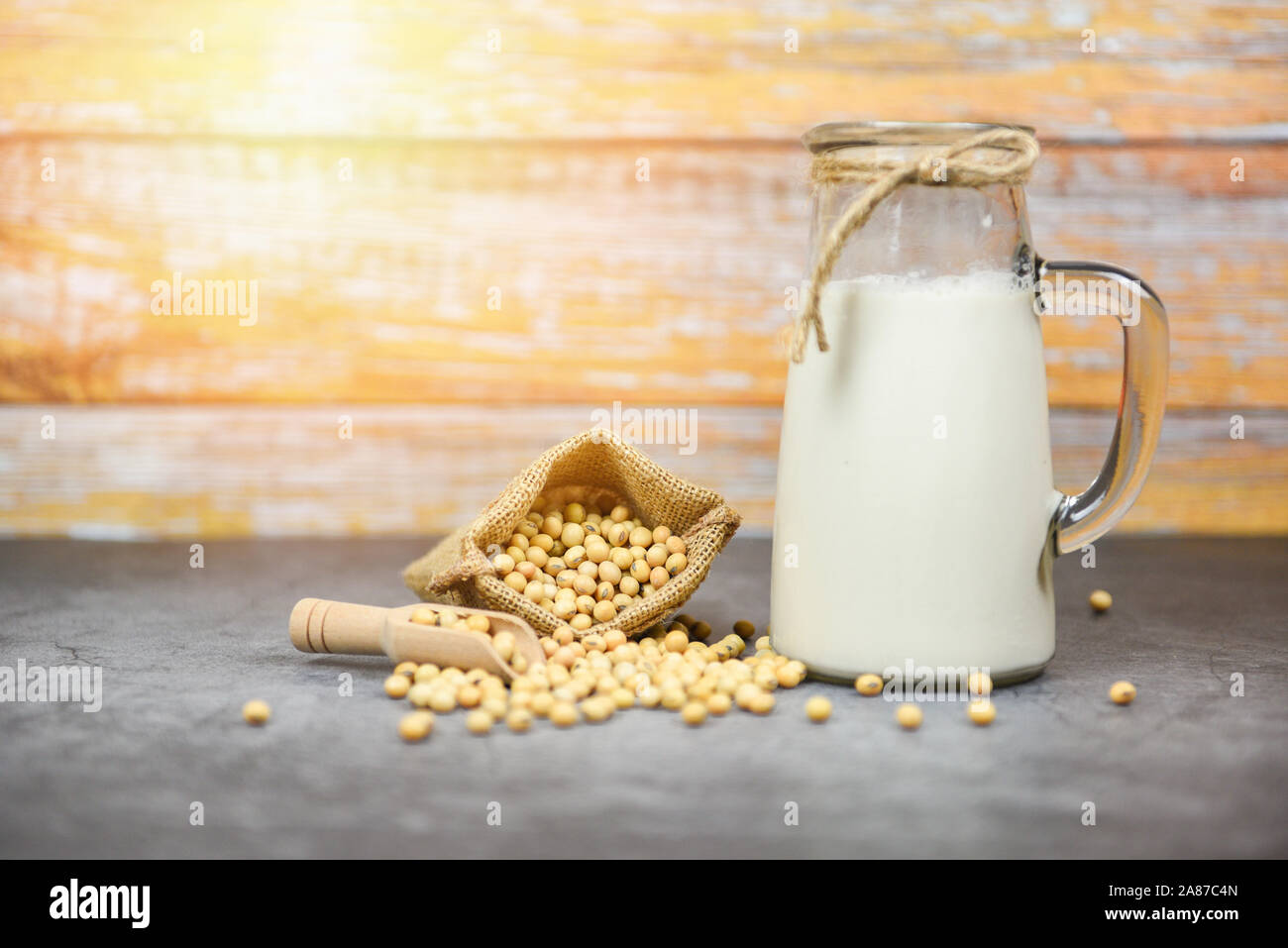 Soybean and dried soy beans on white bowl / Soy milk in glass jar for healthy diet drink and natural bean protein Stock Photo