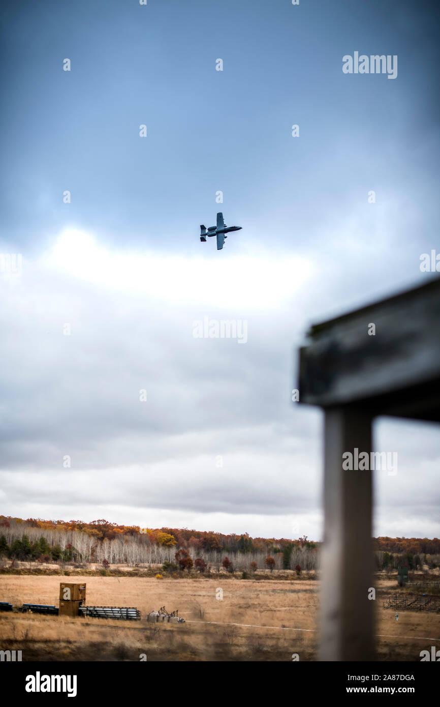 Joint Terminal Attack Controllers from the Latvian National Armed Forces conduct close air support training with A-10 Thunderbolt II aircraft assigned to the 107th Fighter Squadron, Selfridge Air National Guard Base, Mich., at Grayling Aerial Gunnery Range in Waters, Mich., October 29, 2019.    Michigan and Latvia have been linked under the U.S. National Guard Bureau's State Partnership Program since 1993. The collaboration between JTACs in the Latvian National Armed Forces and the Michigan Air National Guard has been one of the most productive examples of bilateral defense cooperation in the Stock Photo