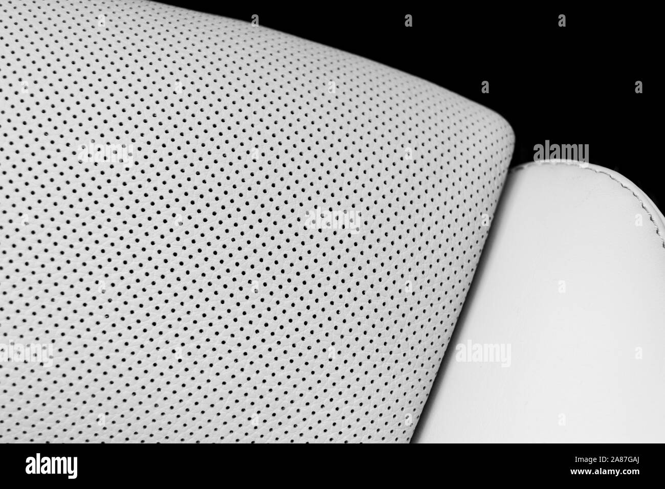White leather interior of the luxury modern car. Perforated white leather comfortable seats with White leather interior of the luxury modern car. Perforated white leather comfortable seats with