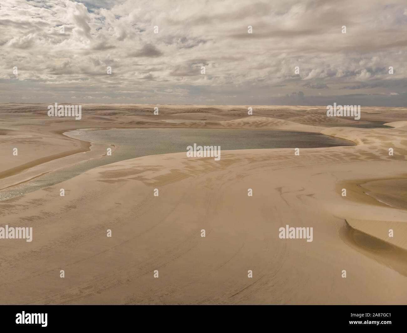 Aerial shot of the sand dunes and lagoons in Brazil, Lencois Maranhenses national park in Maranhao state.Lago azul Stock Photo