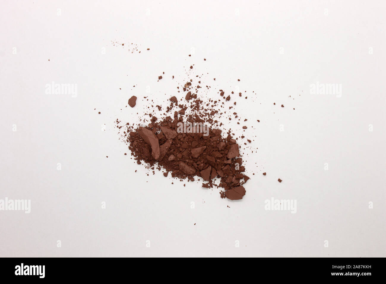 This is a photograph of a deep Brown Powder Eye shadow isolated on a ...