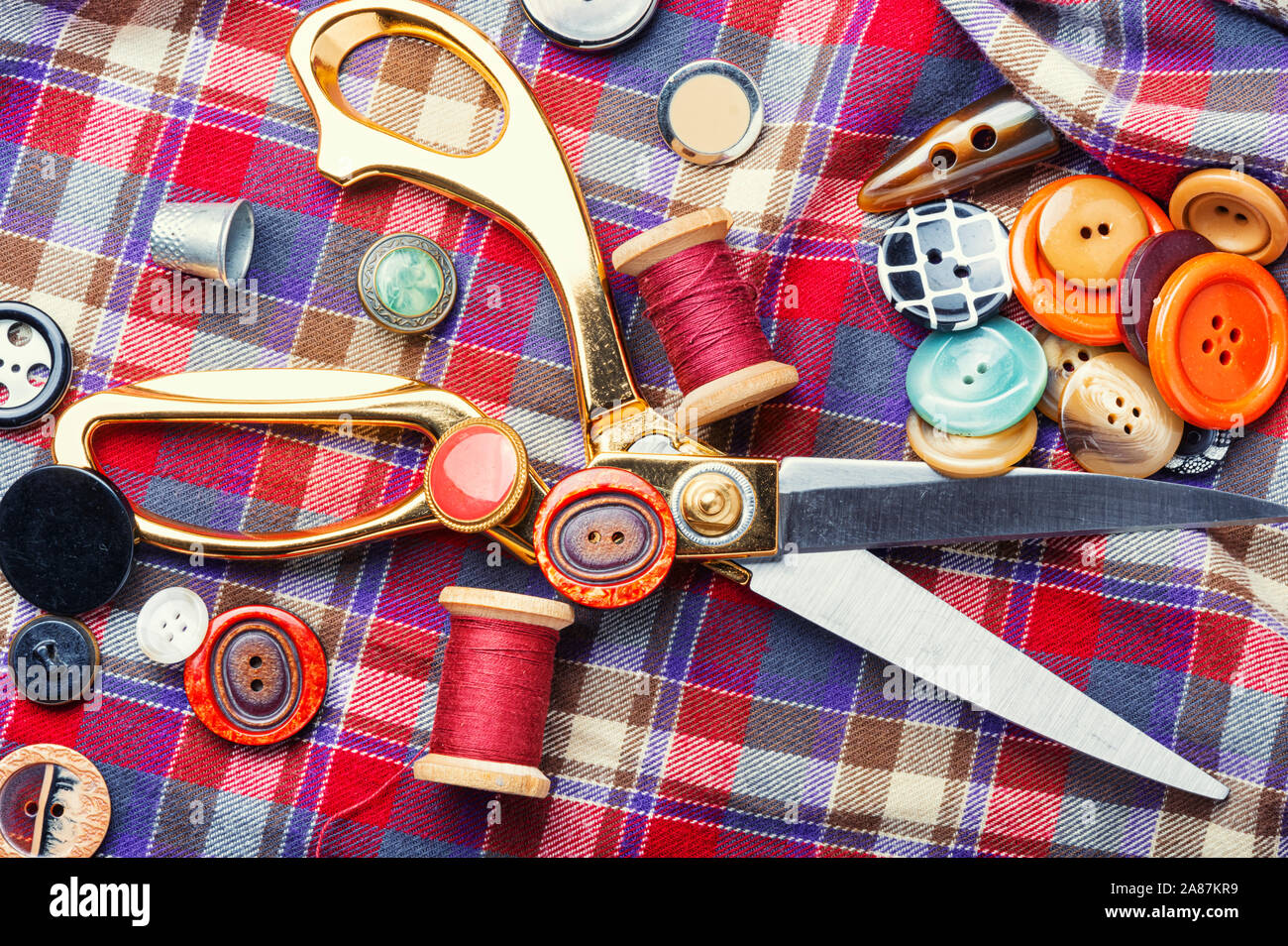 Sewing tools, scissors, buttons and threads on fabric Stock Photo Alamy