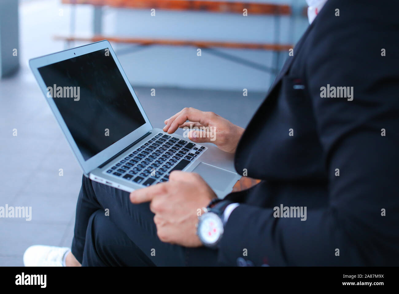 Cool guy arabic man uses laptop business center Stock Photo
