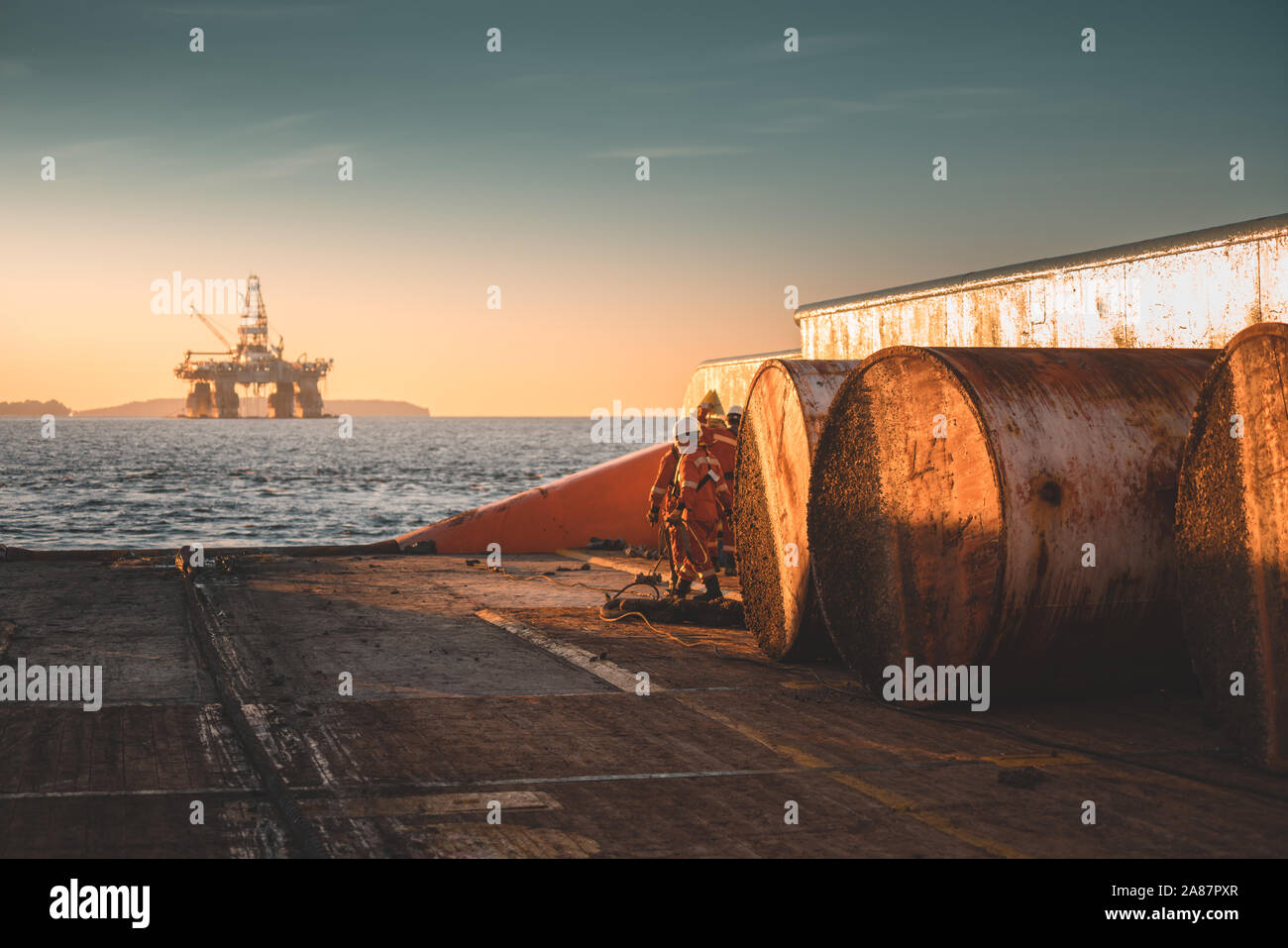 An evening view during rig move operation from the vessel with semi submersible drilling rig at the background Stock Photo