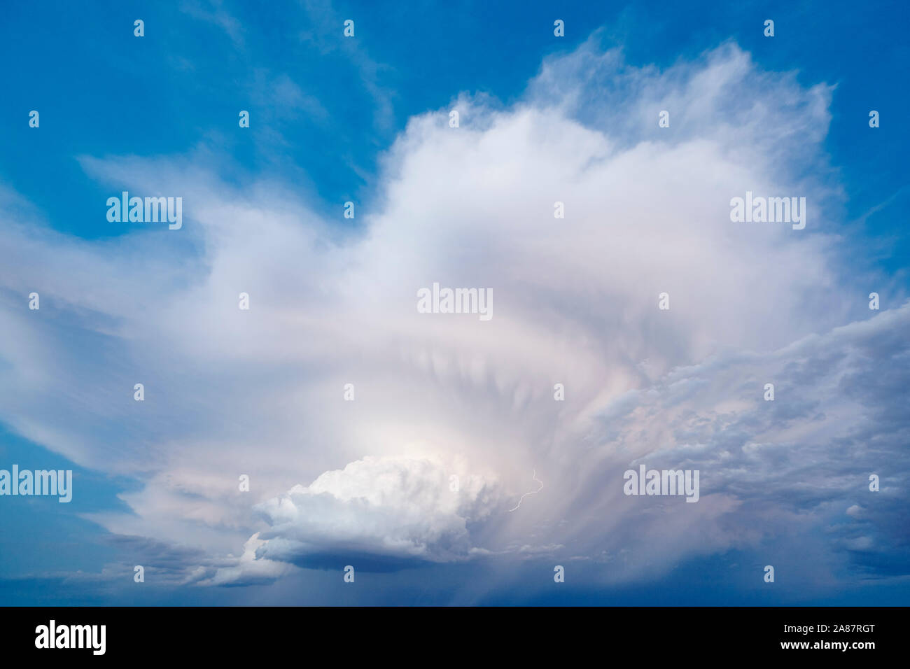 Cloudy stormy dramatic sky with lightning strike. Thunder cloudscape. Meteorology Stock Photo