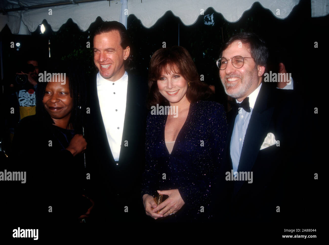 Universal City, California, USA 5th March 1995 Comedian/actress Whoopi Goldberg, Lyle Trachtenberg, actress Michele Lee and husband Fred A. Rappoport attend the 21st Annual People's Choice Awards on March 5, 1995 at Sound Stage 12, Universal Studios in Universal City, California, USA. Photo by Barry King/Alamy Stock Photo Stock Photo