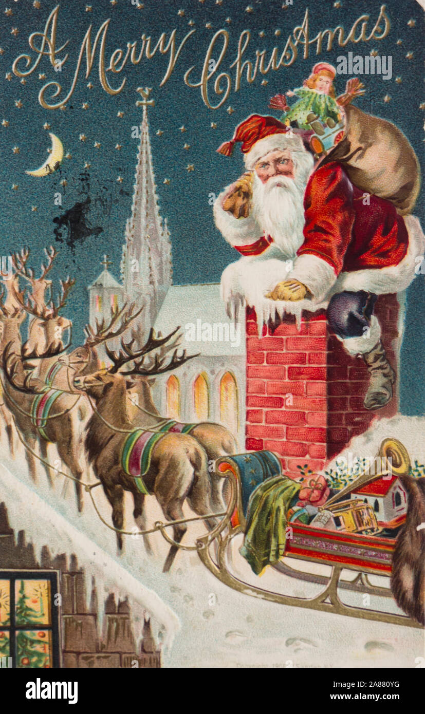 A colorfulvintage merry Christmas card with Santa on his way down the chimney on a snowy night, complete with reindeer sack of gifts and sled, used in New York USA ca 1910 Stock Photo