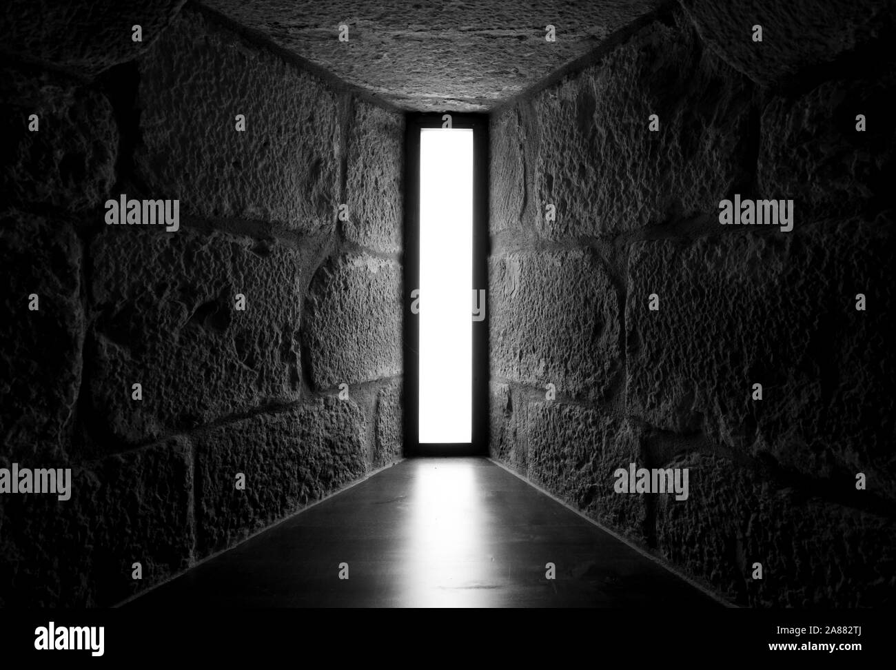 Perspective view of concrete and stone wall with skylight glass window. Interior architecture