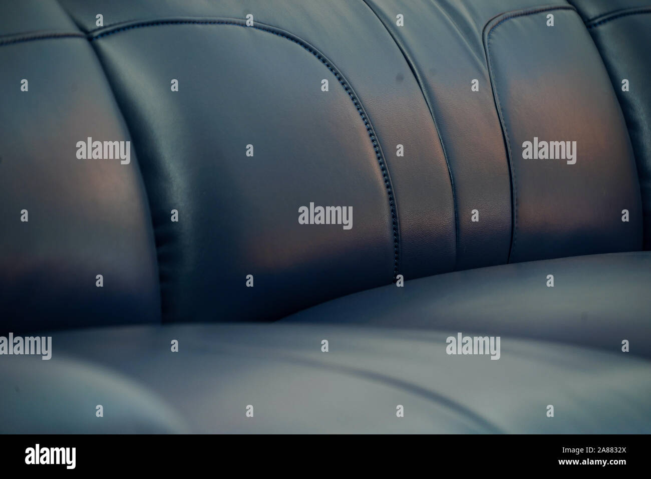 Dark blue fabric sofa, close up detail texture Stock Photo