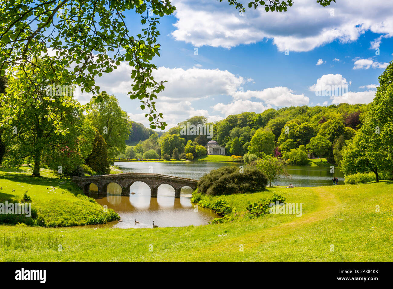 Looking across the lake with its Palladian Bridge towards the Pantheon at  Stourhead Gardens, Wiltshire, England, UK Stock Photo - Alamy