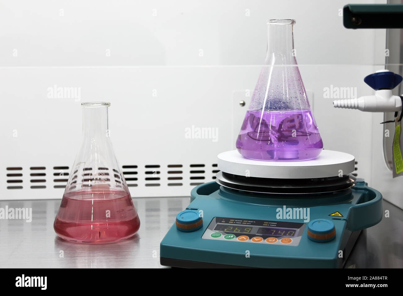 Measuring bottles in the laboratory Stock Photo Alamy