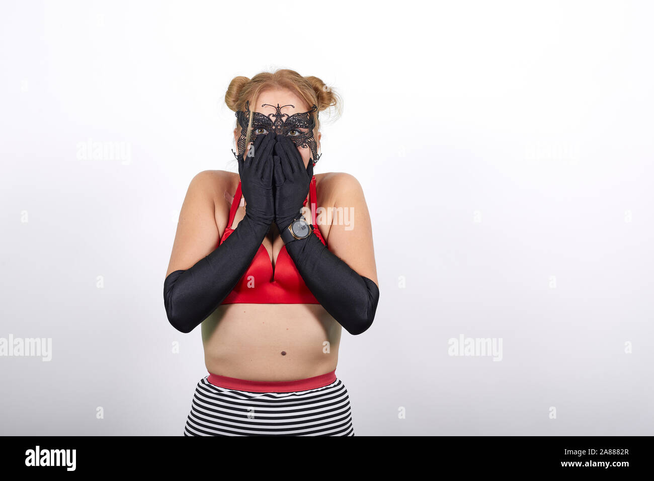 Woman trying to fasten her bra Stock Photo