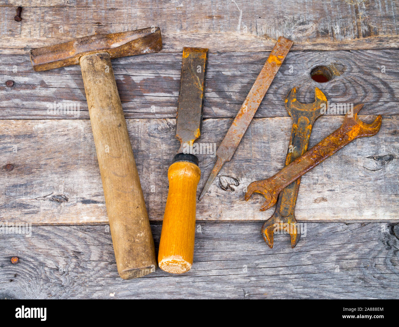 Old rusty vintage tools on weathered background Stock Photo - Alamy