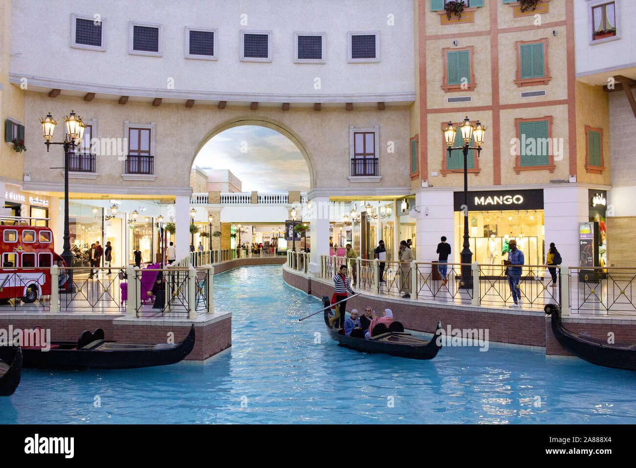 venice canal in Villaggio Mall, shopping center in Aspire Zone. Luxury brands, expensive stores and exclusive shops in Doha shopping mall in venetian Stock Photo