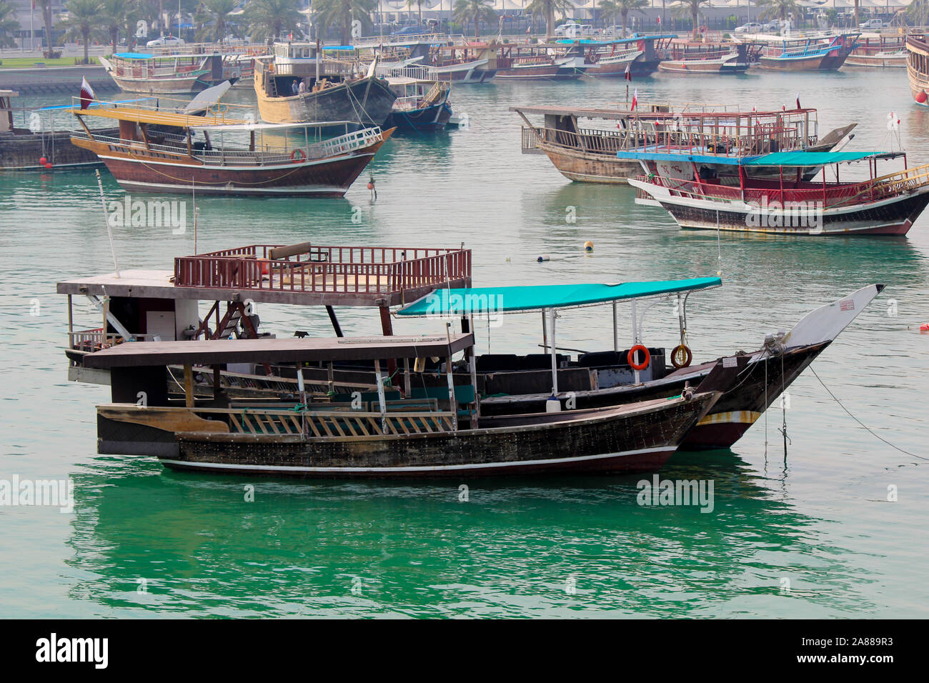 Traditional boats called Dhows are anchored in the port near the Museum