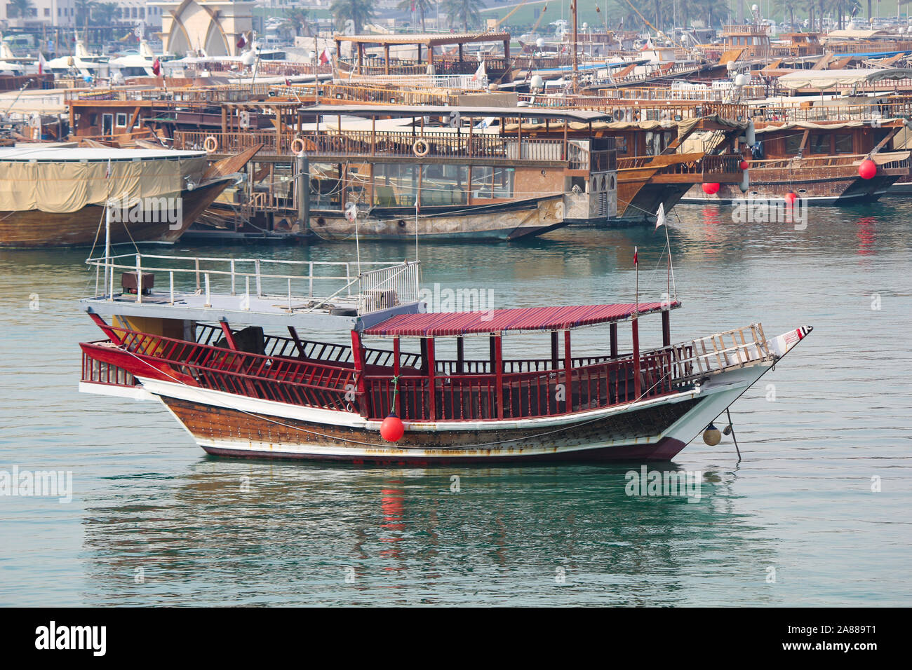 Traditional boats called Dhows are anchored in the port near the Museum