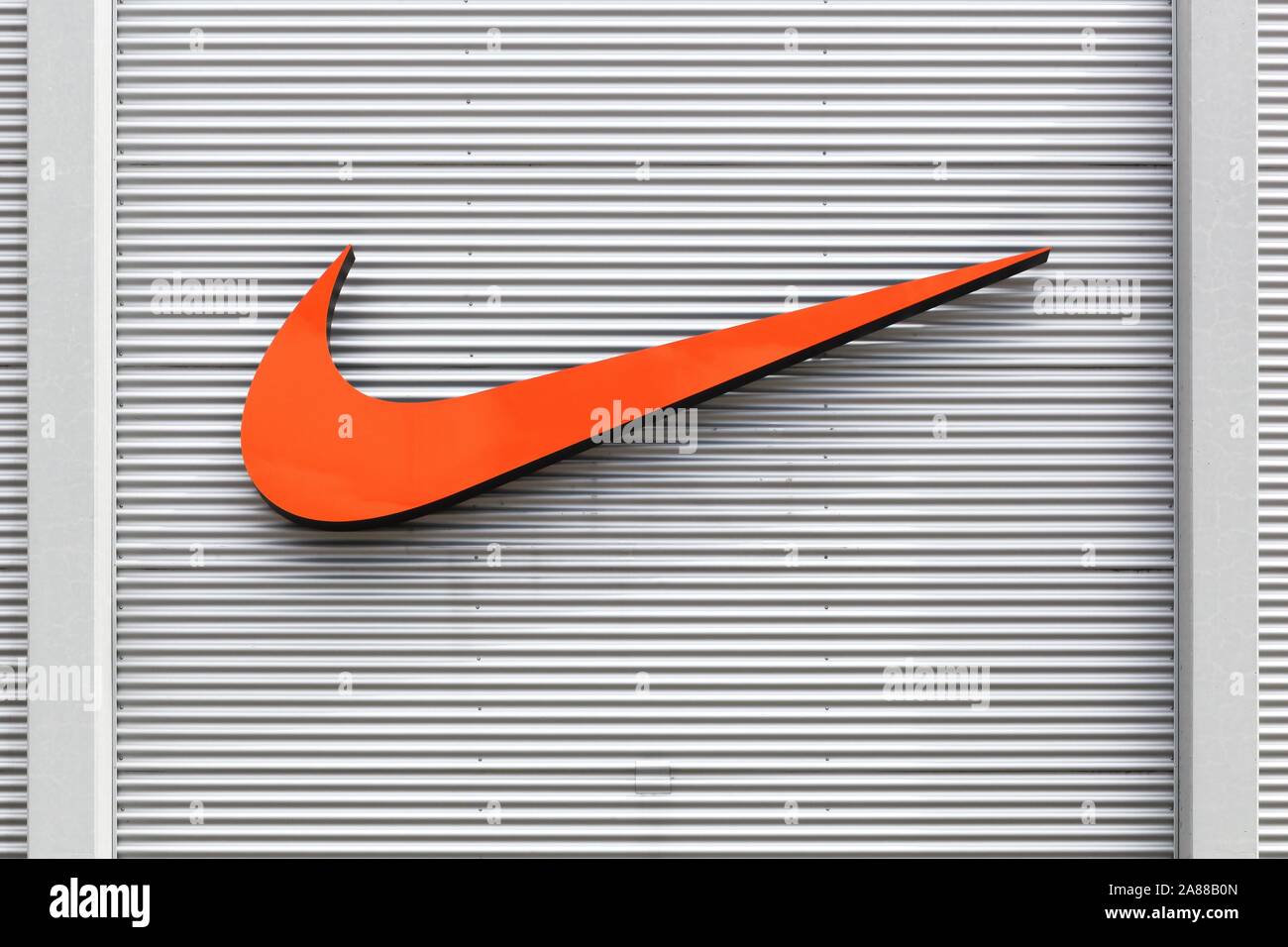 Bremen, Germany - July 2, 2017: Nike logo on a facade of a store. Nike is an American company specializing in sports equipment based in Beaverton, USA Stock Photo