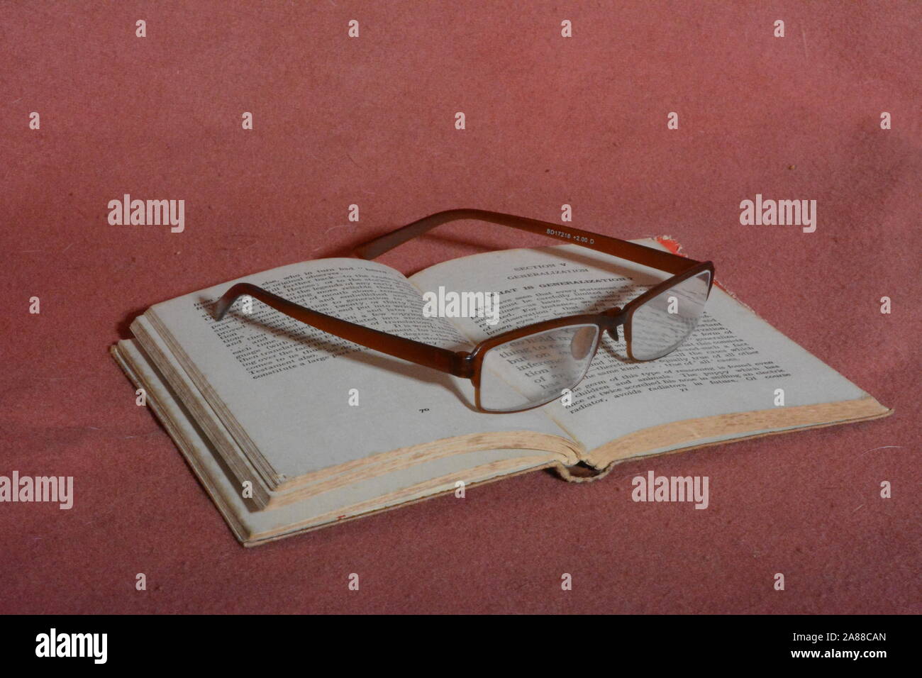 Glasses and book Stock Photo - Alamy