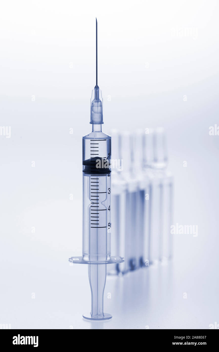 Download Glass Medicine Ampoules With Liquid And Syringe On White Background Toned In Blue Image Stock Photo Alamy PSD Mockup Templates