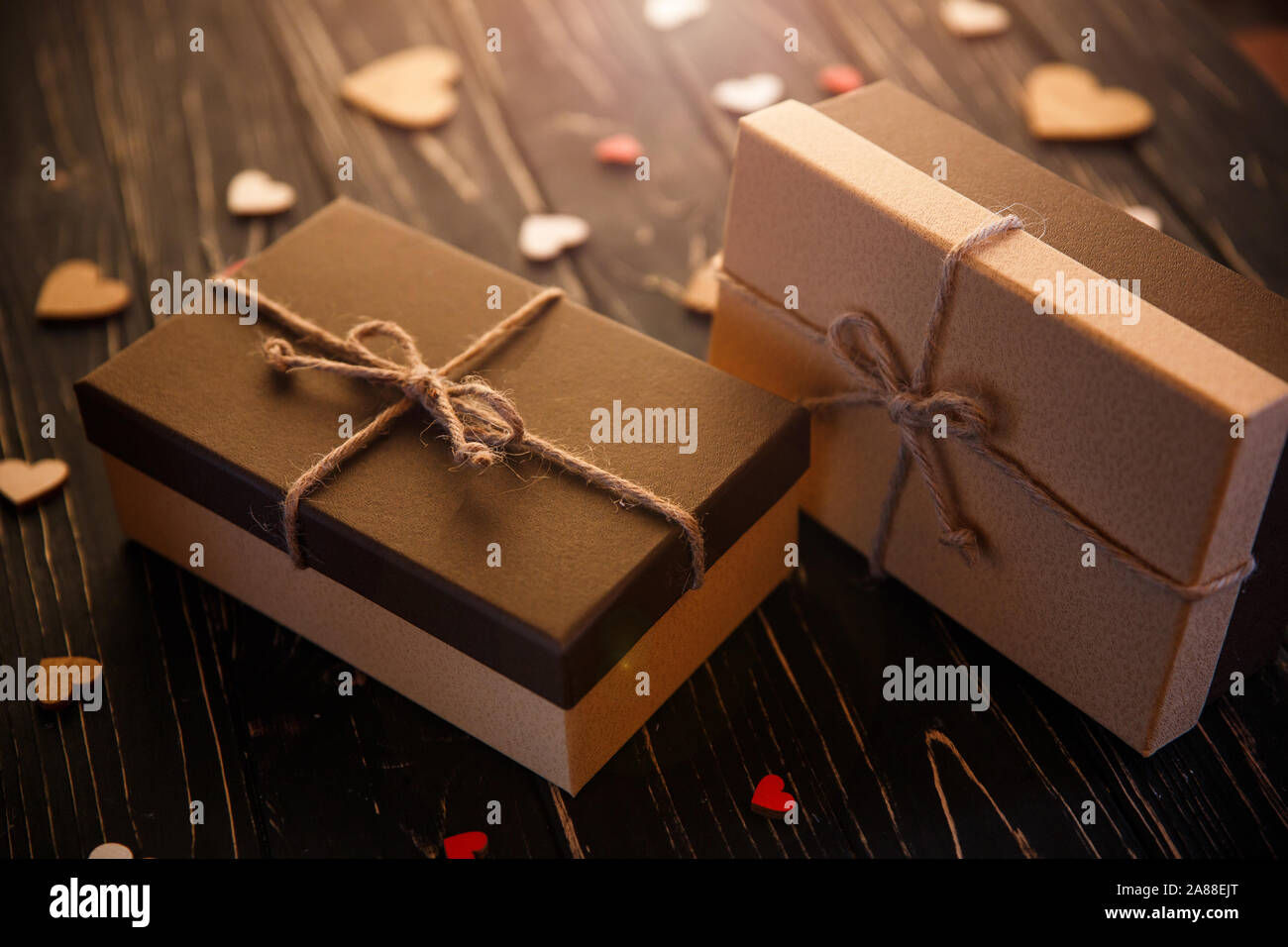 Two brown gift boxes on a wooden background Stock Photo