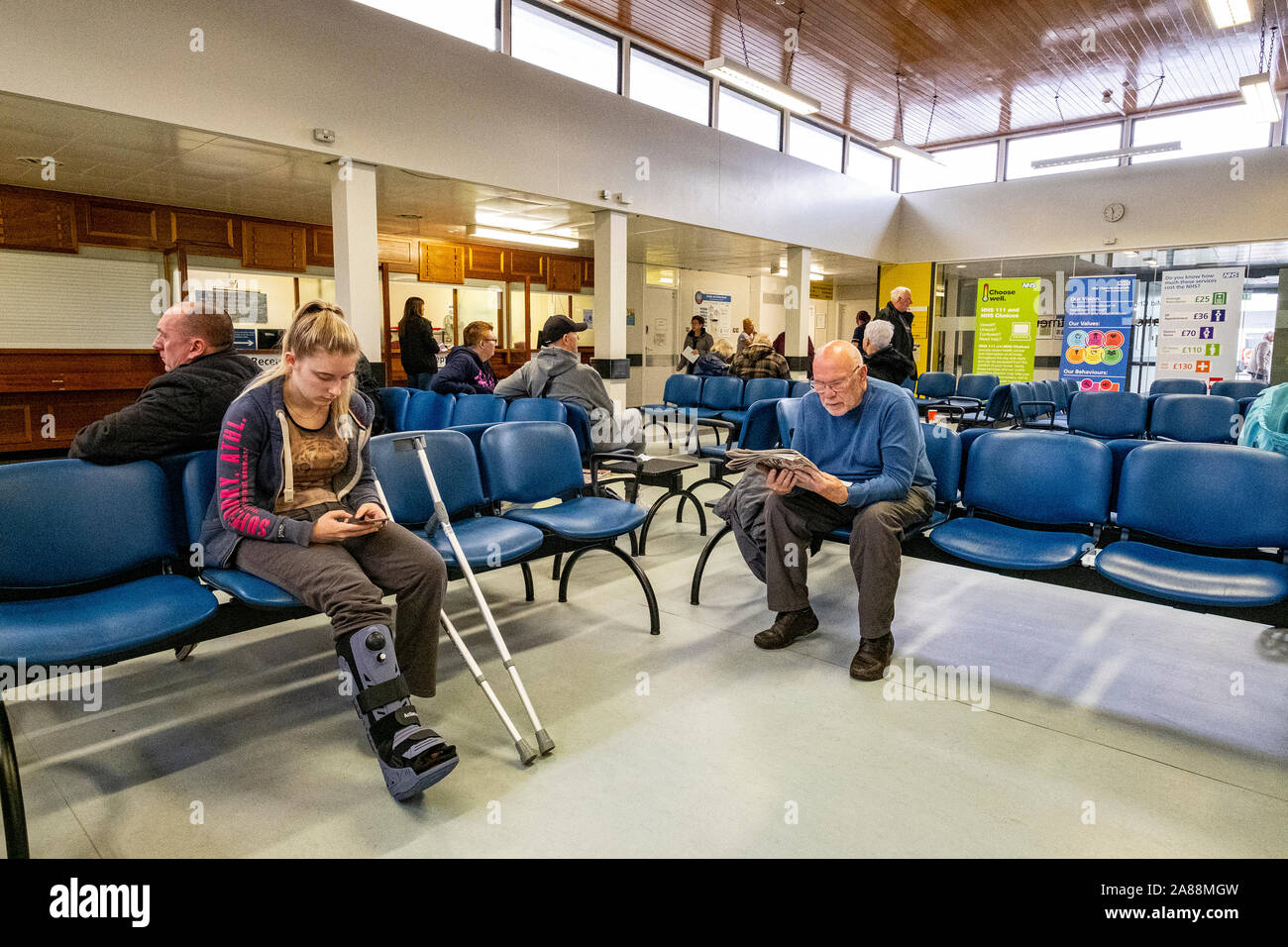Reception area in NHS hospital or doctor's waiting room with patient's Stock Photo