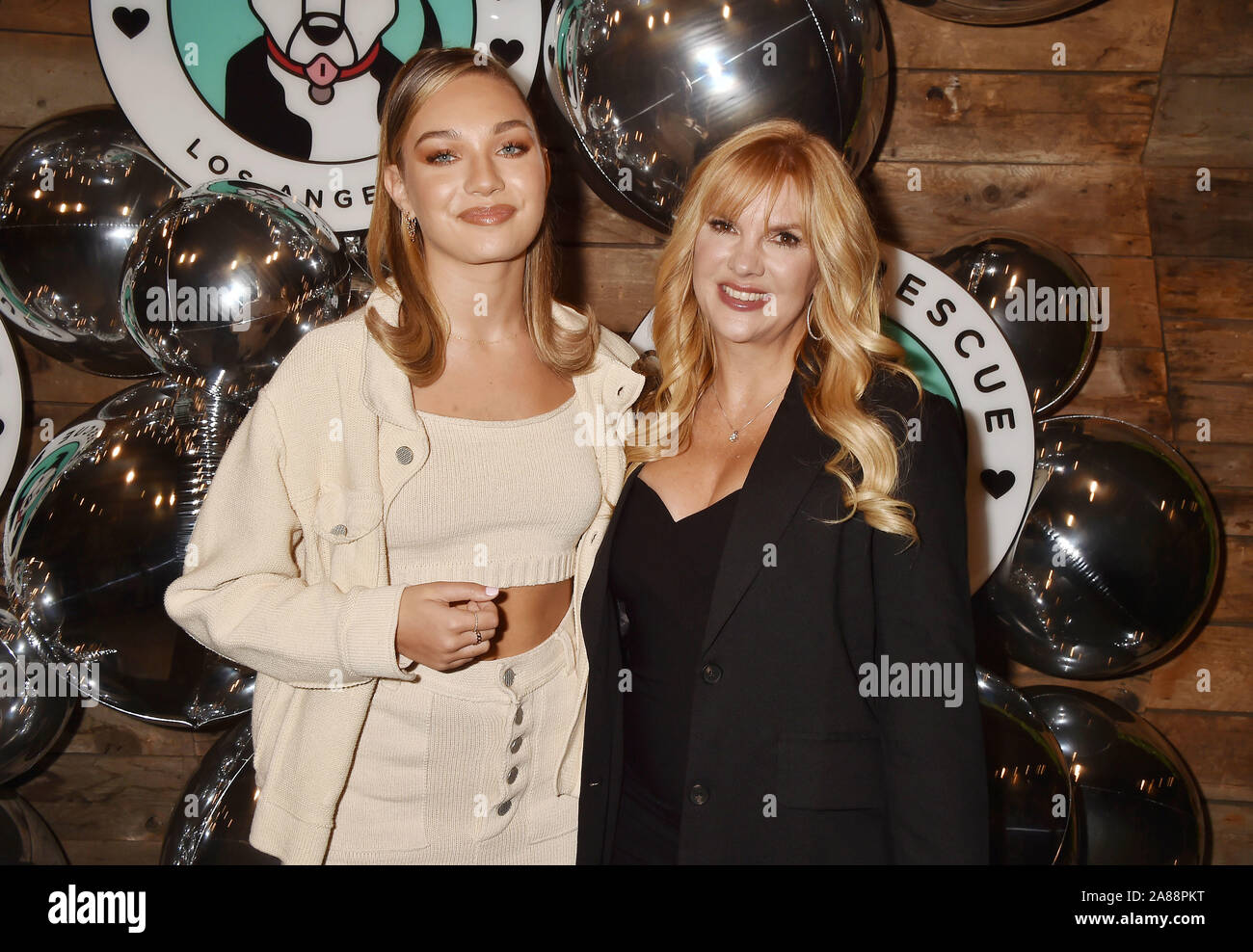LOS ANGELES, CA - NOVEMBER 06: Maddie Ziegler (L) and Melissa Gisoni attend  Love Leo Rescue's 2nd