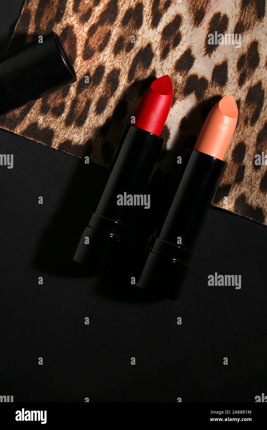 Lipstick. Fashion Colorful Lipsticks over black background. Lipstick