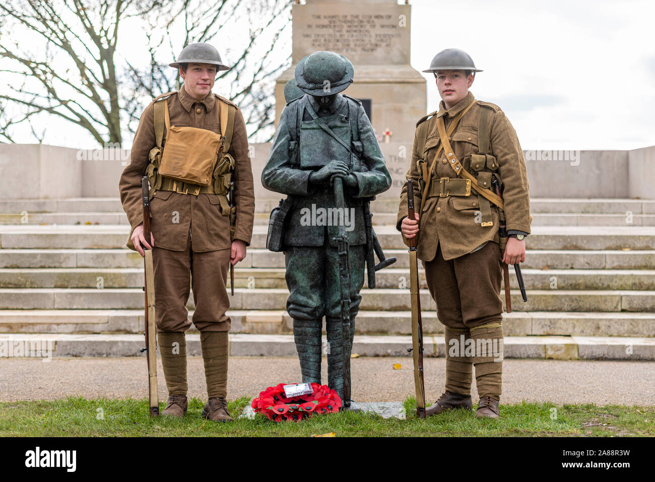 Southend Cenotaph, Southend on Sea, Essex, UK. A bronze statue of a British ‘Tommy’ soldier has been unveiled in front of the Lutyens designed war memorial in preparation for Remembrance Sunday. The statue has been created by local artist and sculptor Dave Taylor using young WWI re-enactor Ethan Harvey (left of statue) as a model to create a faithful replica of what a soldier would look like on the first day of the Battle of the Somme. Ethan's brother Reuben also attended in uniform Stock Photo