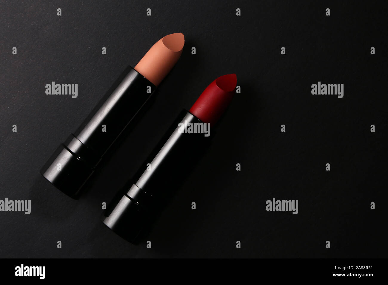 Lipstick. Fashion Colorful Lipsticks over black background. Lipstick