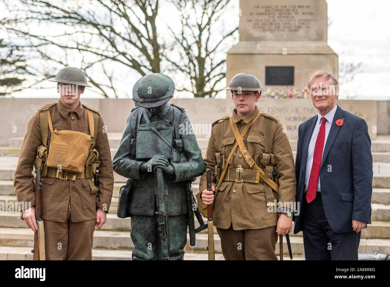 Southend Cenotaph, Southend on Sea, Essex, UK. A bronze statue of a British ‘Tommy’ soldier has been unveiled in front of the Lutyens designed war memorial in preparation for Remembrance Sunday. The statue has been created by local artist and sculptor Dave Taylor using young WWI re-enactor Ethan Harvey (left of statue) as a model to create a faithful replica of what a soldier would look like on the first day of the Battle of the Somme. Local Tory politician Sir David Amess, MP for Southend West, attended. Ethan's brother Reuben also attended in uniform Stock Photo