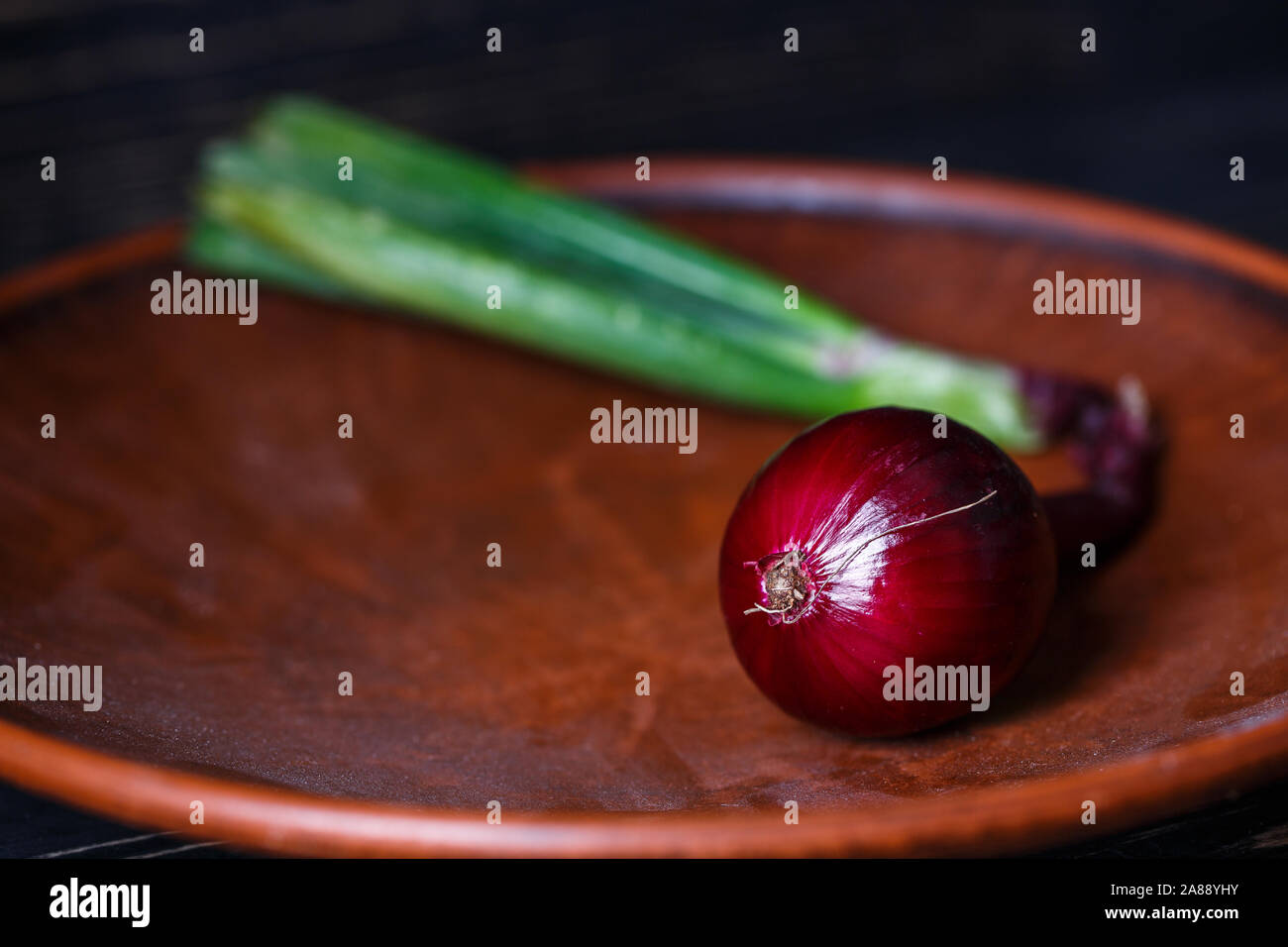 Red onion with leaves Stock Photo Alamy
