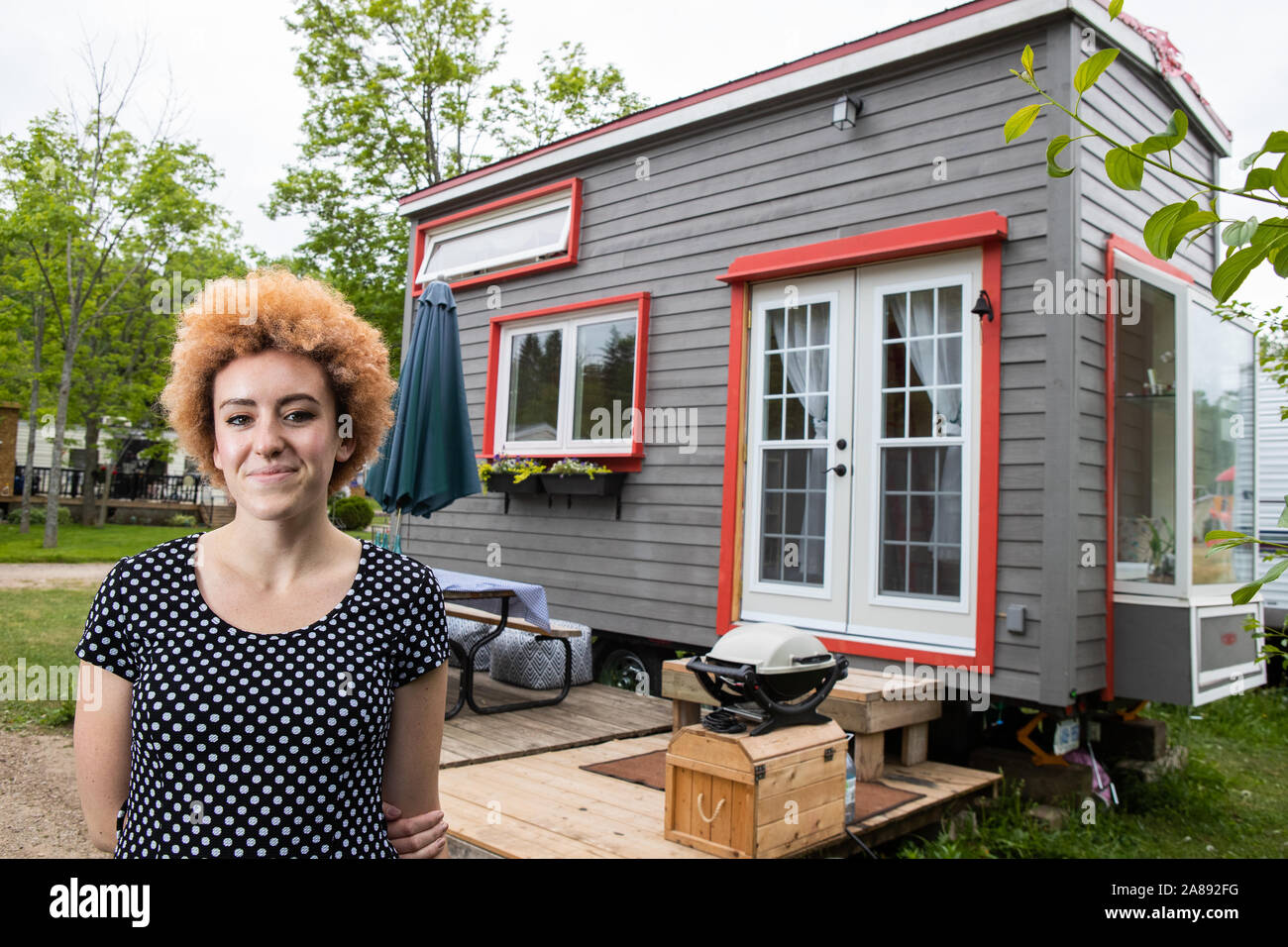 Funky girl shows off her DIY Tiny Home Stock Photo
