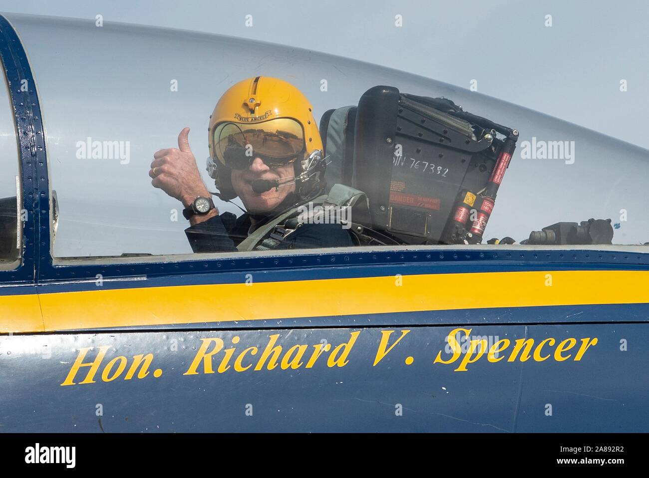 U.S. Navy Secretary Richard V. Spencer gives a thumbs up as he rides the back seat of a Navy F/A-18 Hornet fighter aircraft during a visit to the Blue Angles Flight Demonstration Squadron at Naval Air Station Pensacola November 5, 2019 in Pensacola, Florida. Stock Photo