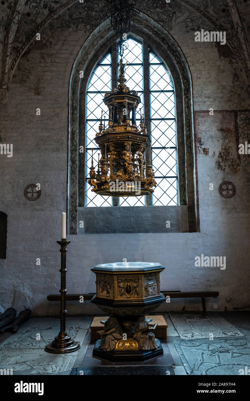 Baptismal font in the interior of the Saint Peter's Church in the center of Malmo, Sweden Stock