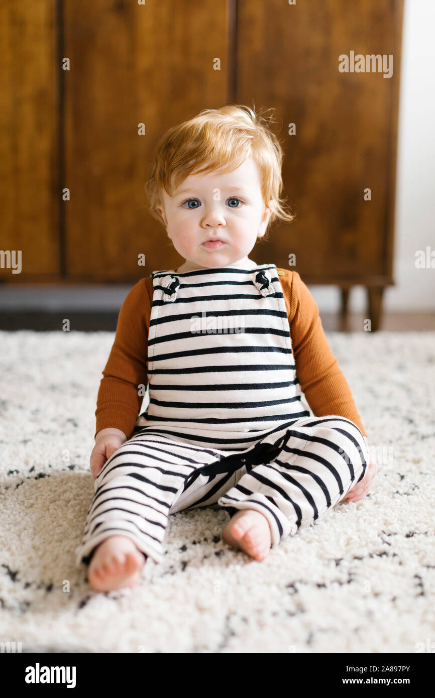 Baby wearing overalls hi-res stock photography and images - Alamy