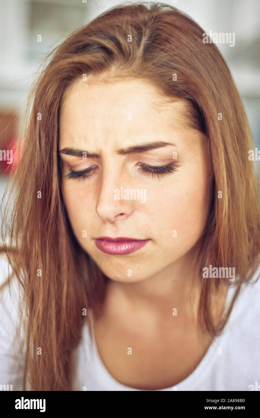 portrait of a brunette teenager Caucasian girl  with an expression concerned Stock Photo