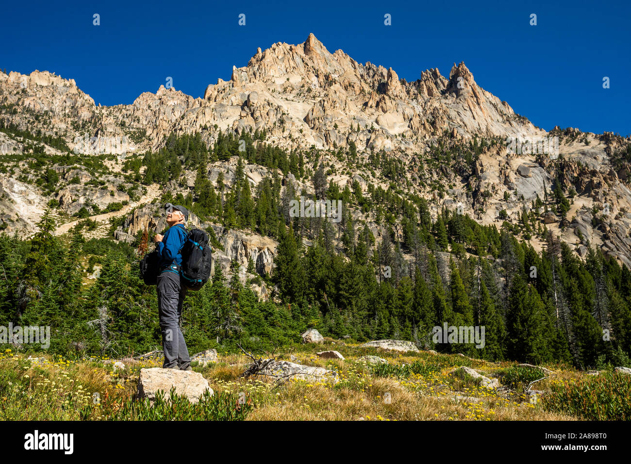 Senior man hiking on Sawtooth Mountains in Stanley, Idaho, USA Stock Photo