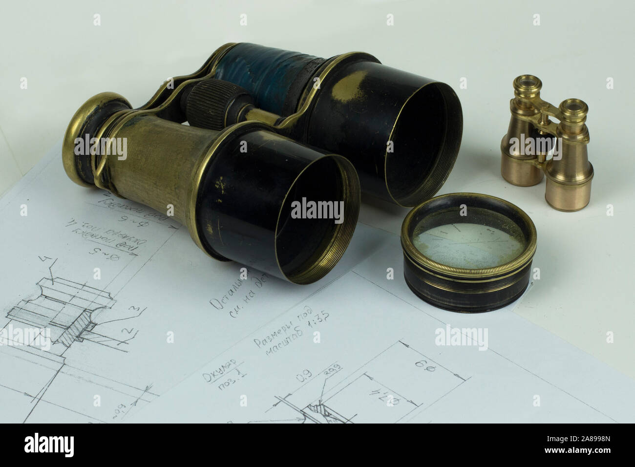 Repair of old binoculars Stock Photo Alamy
