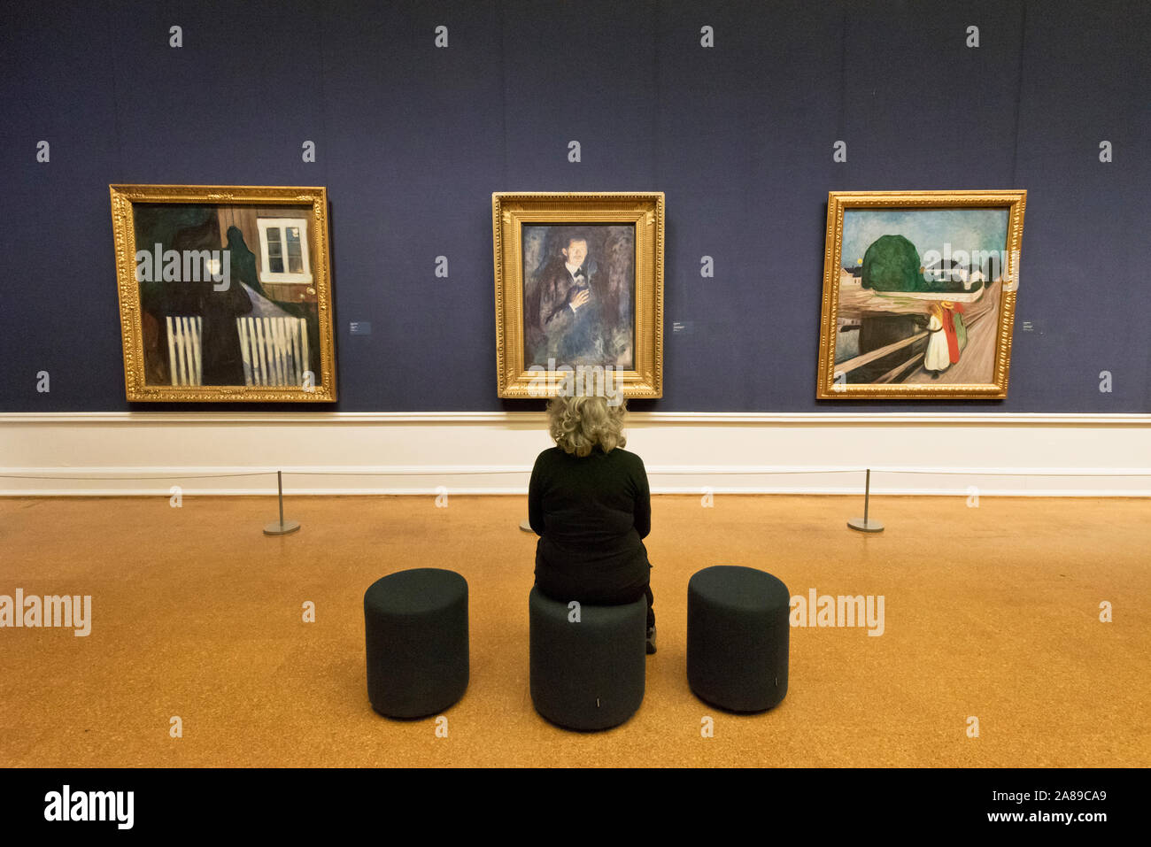 Visitor admiring a self-portrait of Edvard Munch. National Gallery (Nasjonalmuseet) in Oslo. Norway Stock Photo