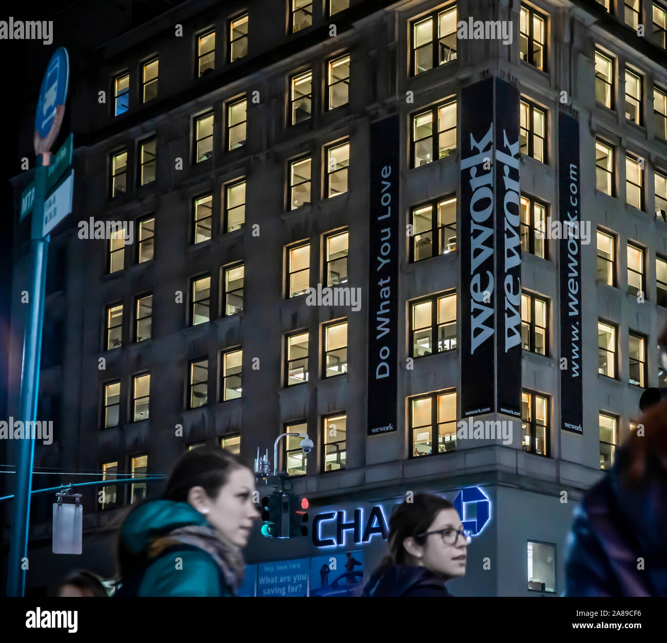 Signs announce the location of a a WeWork co-working space location in  Midtown Manhattan in New York on Friday, November 1, 2019. (© Richard B.  Levine Stock Photo - Alamy