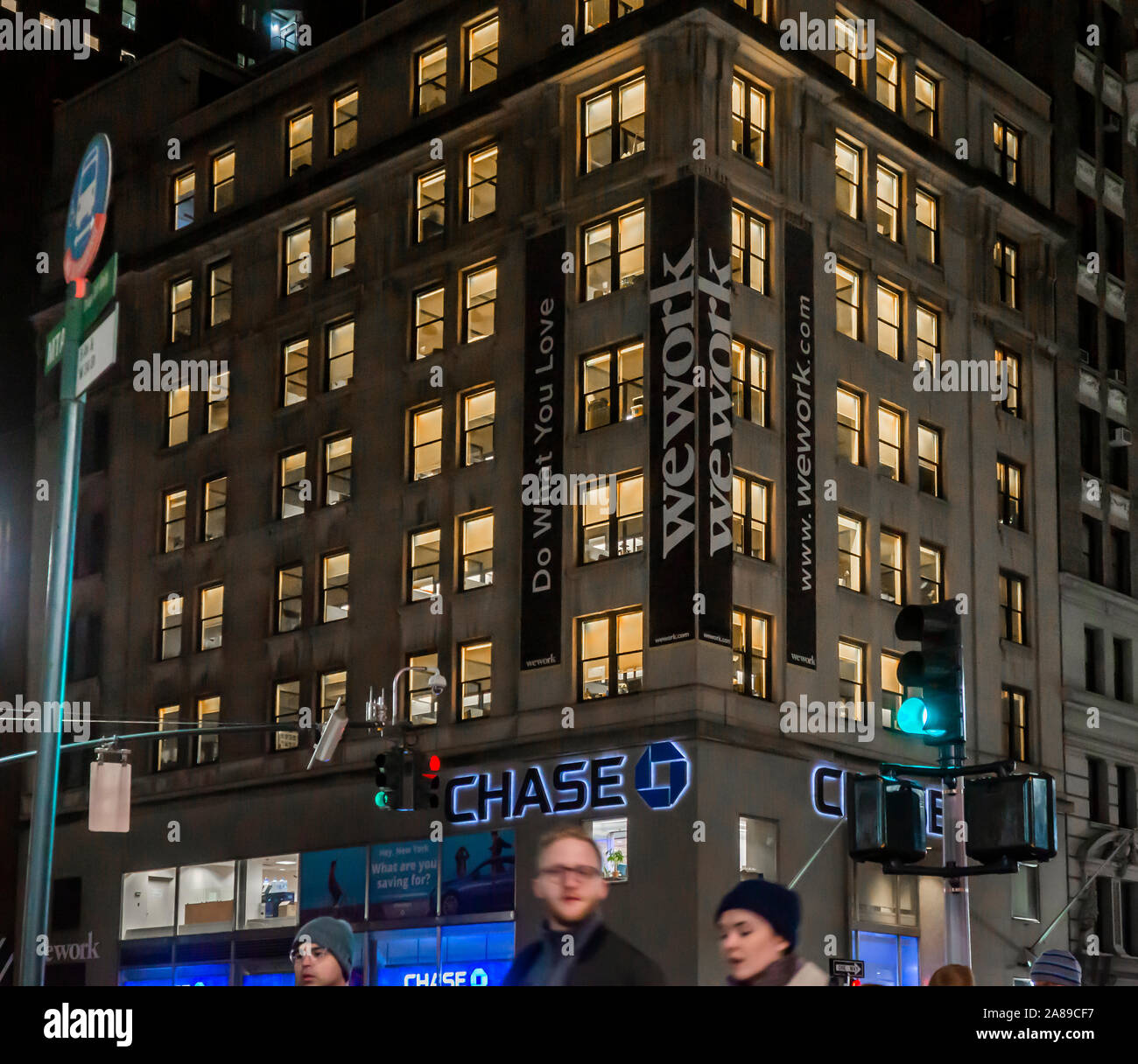 Signs announce the location of a a WeWork coworking space location in