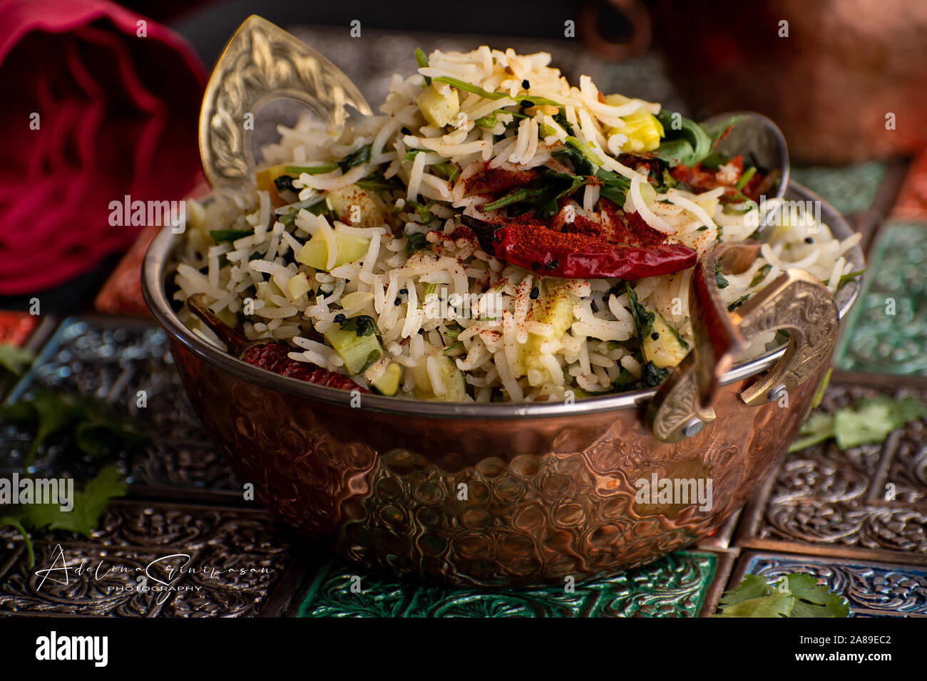 Indian rice pilaf served in traditional copper bowl Stock Photo Alamy