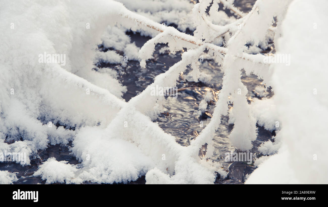 Winter Creek under snow cover Stock Photo
